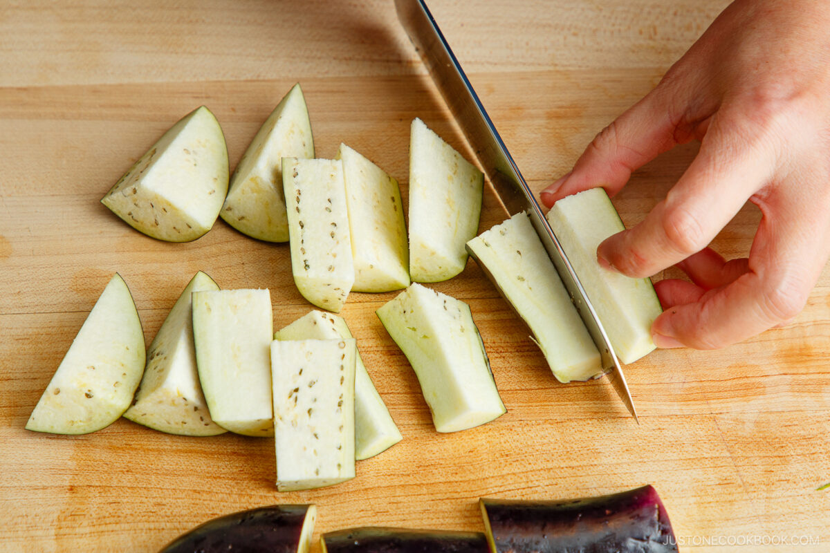Cut the eggplant into smaller pieces and soak in water.