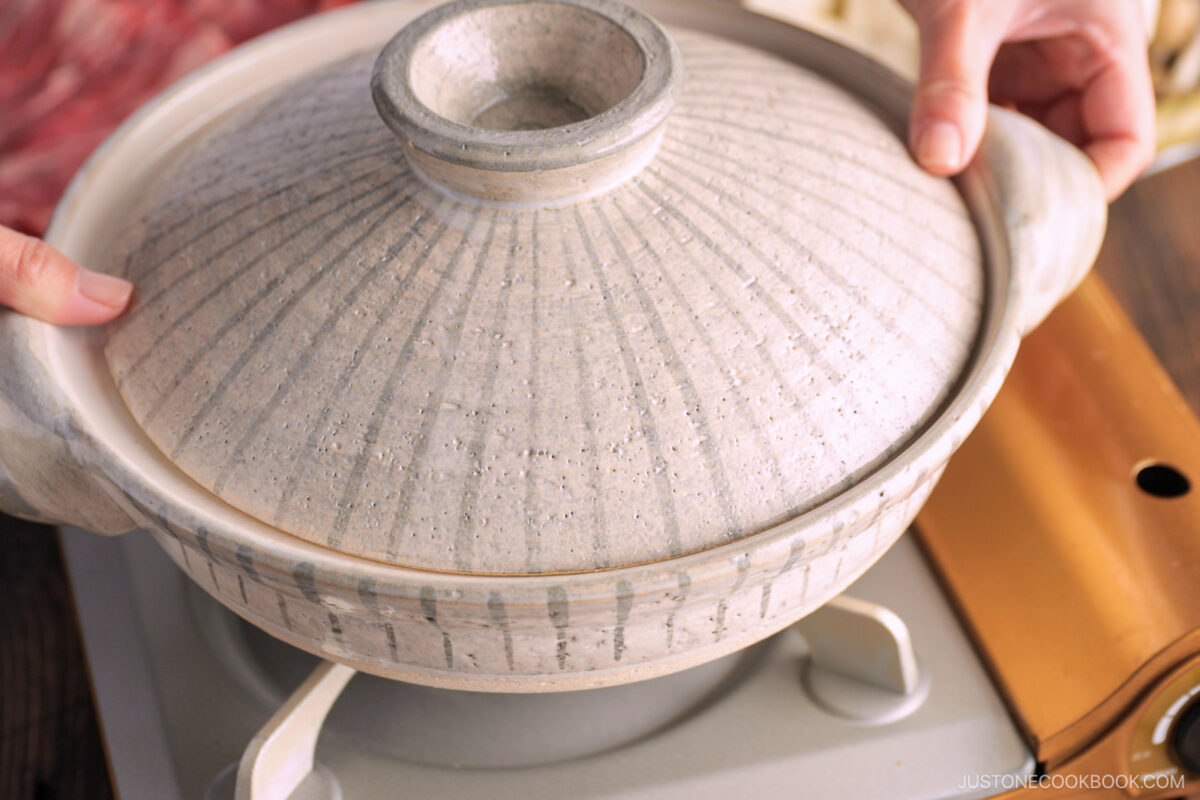 Set up the donabe at the table.