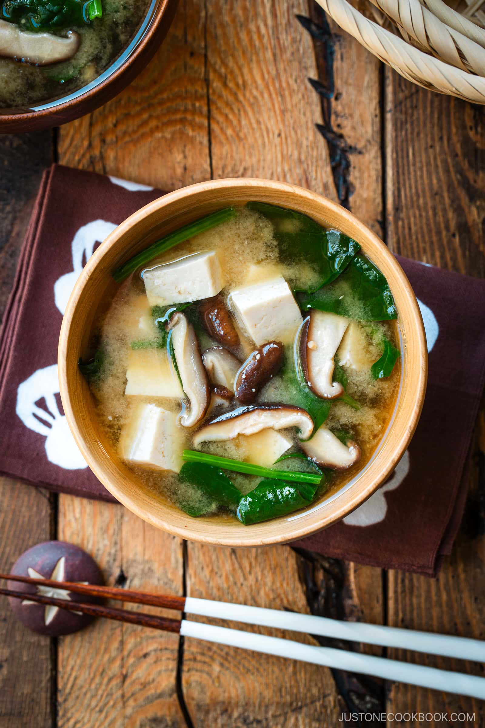 Wooden soup bowls containing Spinach and Mushroom Miso Soup.