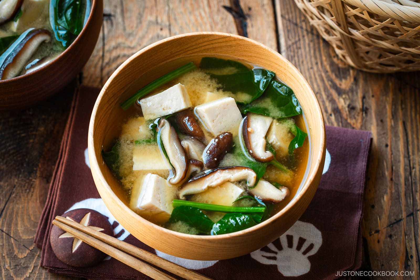 Wooden soup bowls containing Spinach and Mushroom Miso Soup.