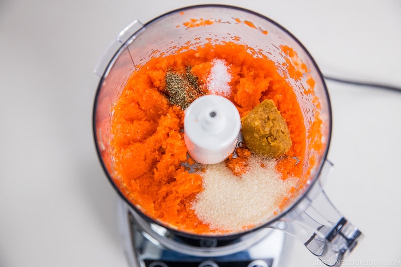Add the seasonings to the chopped vegetable ingredients in the food processor.
