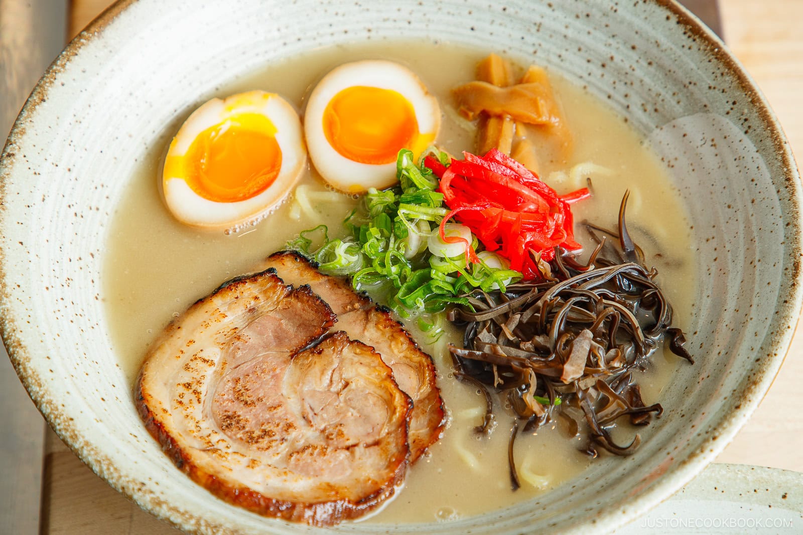 Add the ramen toppings.