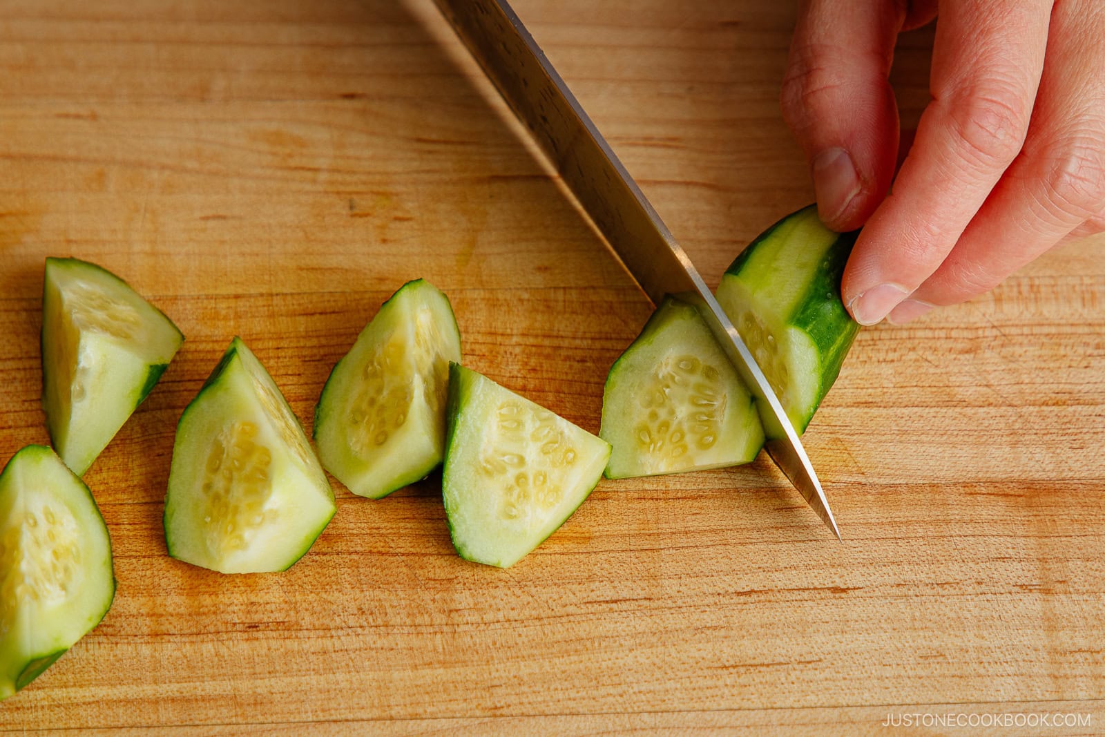 Cutting cucumber in rangiri Japanese cutting technique.
