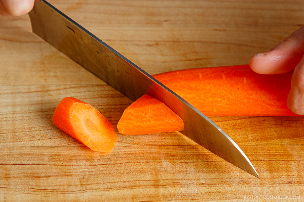 Cutting carrot in rangiri Japanese cutting technique.