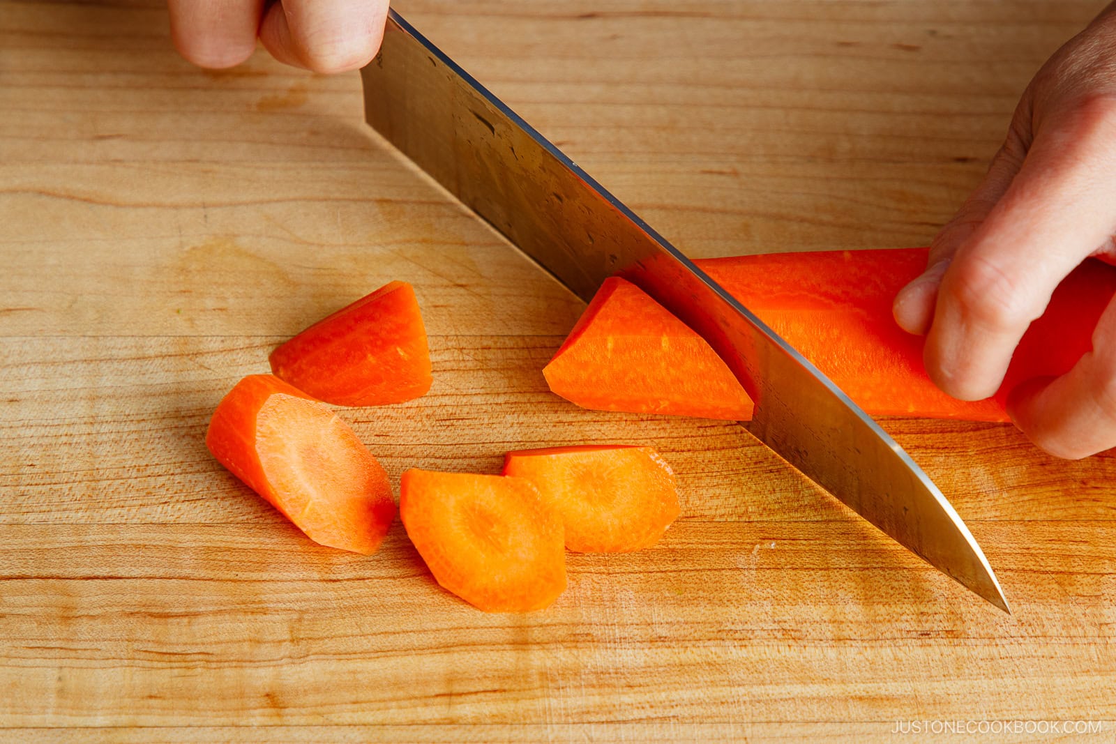 Rolling cut of carrot.
