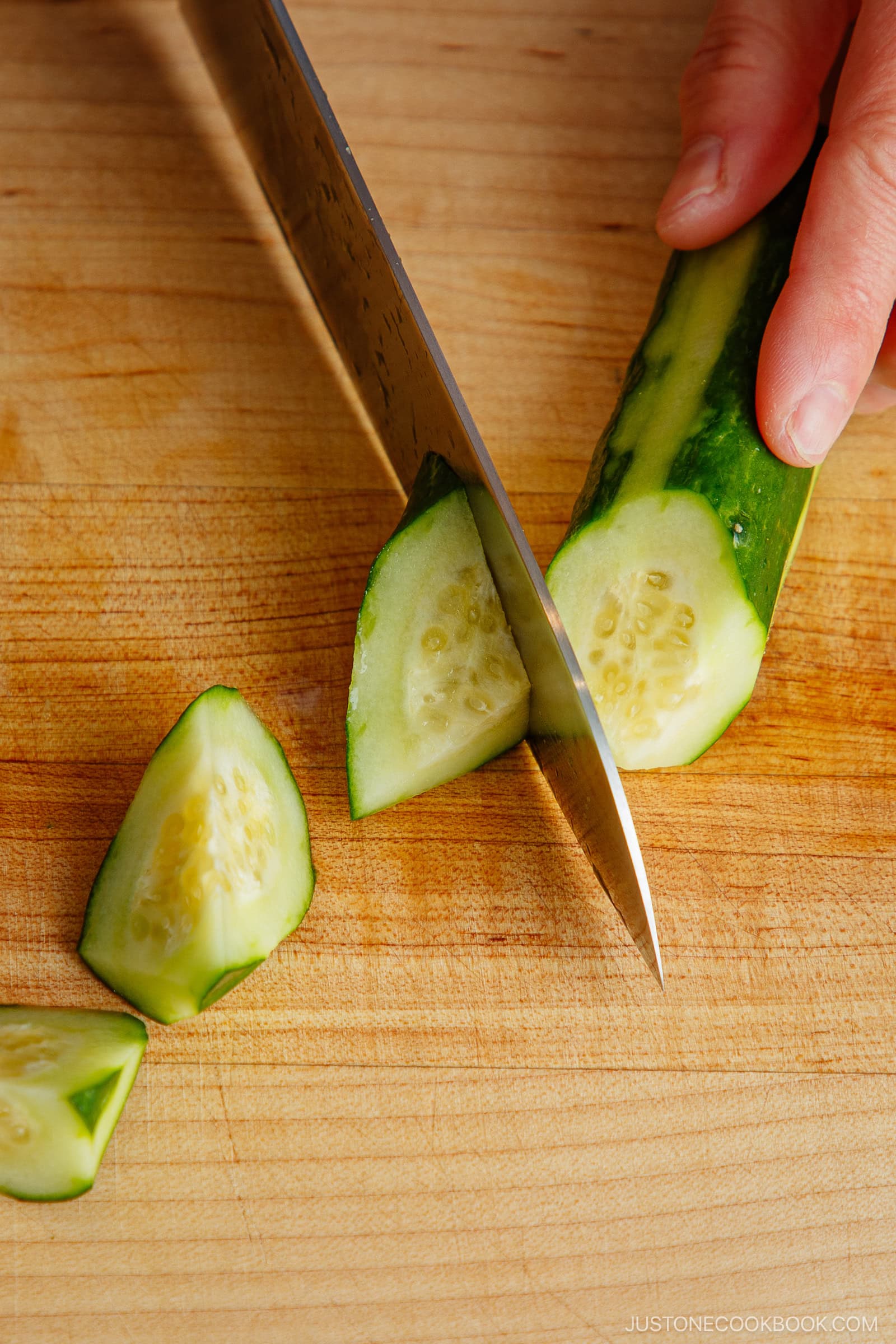 Cutting cucumber in rangiri Japanese cutting technique.
