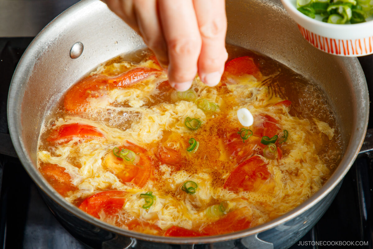 Add the sliced green onions.