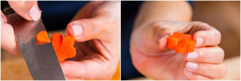 A close-up of hands carving a carrot slice into a small flower shape using a knife, then holding up the finished carrot flower for display.