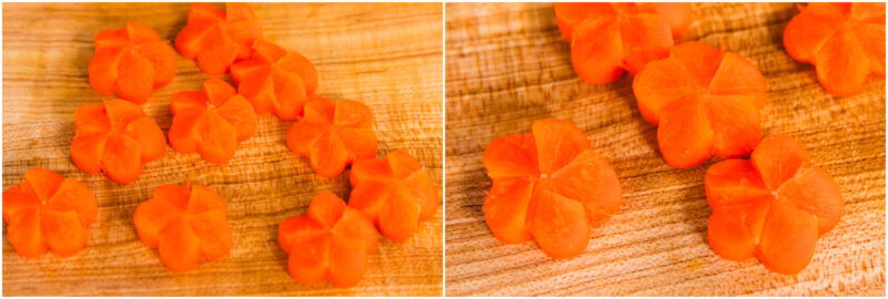 Sliced carrot pieces shaped like flowers are arranged on a wooden cutting board, shown in close-up detail.
