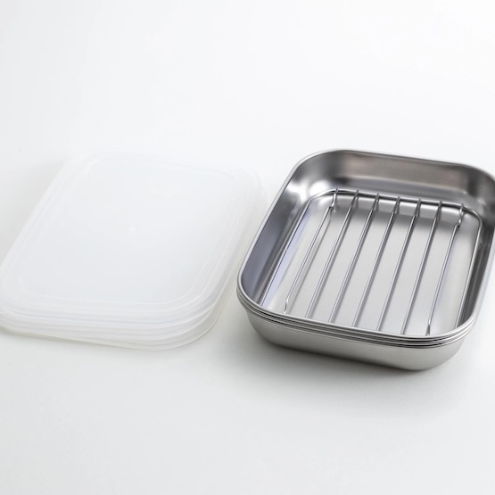Reusable silicone food storage containers with a stainless steel baking tray for Japanese cuisine storage and meal prep.