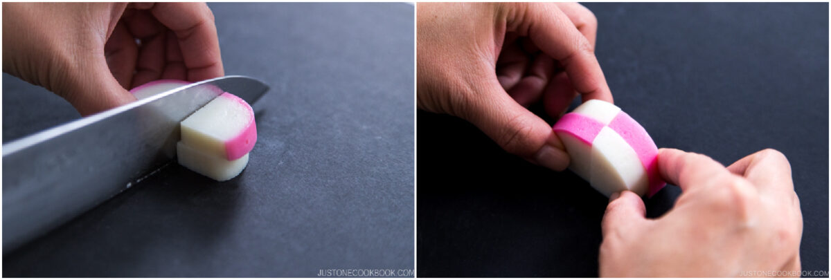 A person slices and shapes a piece of pink and white kamaboko fish cake on a black surface, using a knife and their hands.