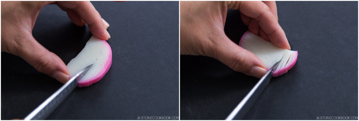 Close-up of hands holding a slice of fish cake and making fine cuts with a knife on a dark surface, preparing the ingredient for cooking.