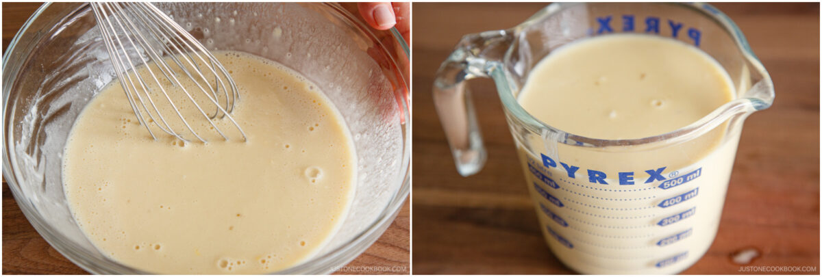A bowl with batter being whisked, and a measuring cup filled with the same smooth, pale batter sitting on a wooden surface.