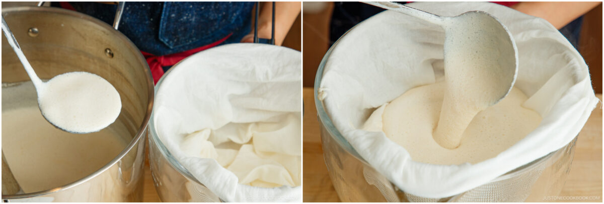 A person pours a creamy liquid from a ladle through a cloth-lined strainer over a large pot, preparing to filter the mixture.