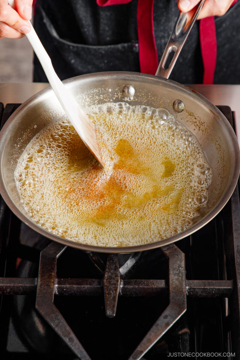 A pan with a spatula in it.