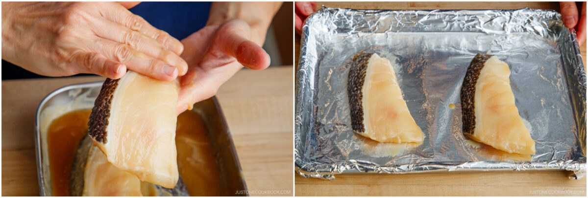A person marinates fish fillets in sauce, then places two fillets with skin on a foil-lined baking sheet, ready for cooking.