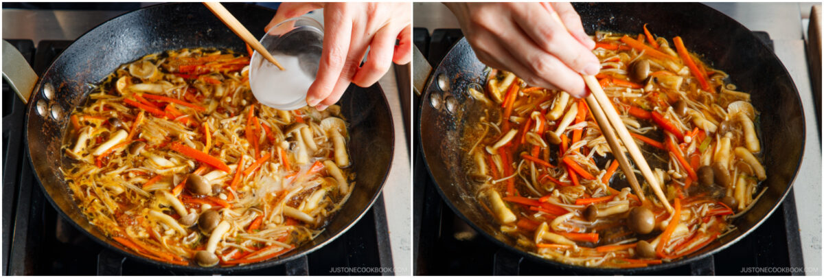 A person adds a white liquid from a small bowl into a pan of simmering mushrooms, carrots, and vegetables, then stirs the mixture using chopsticks on a stovetop.