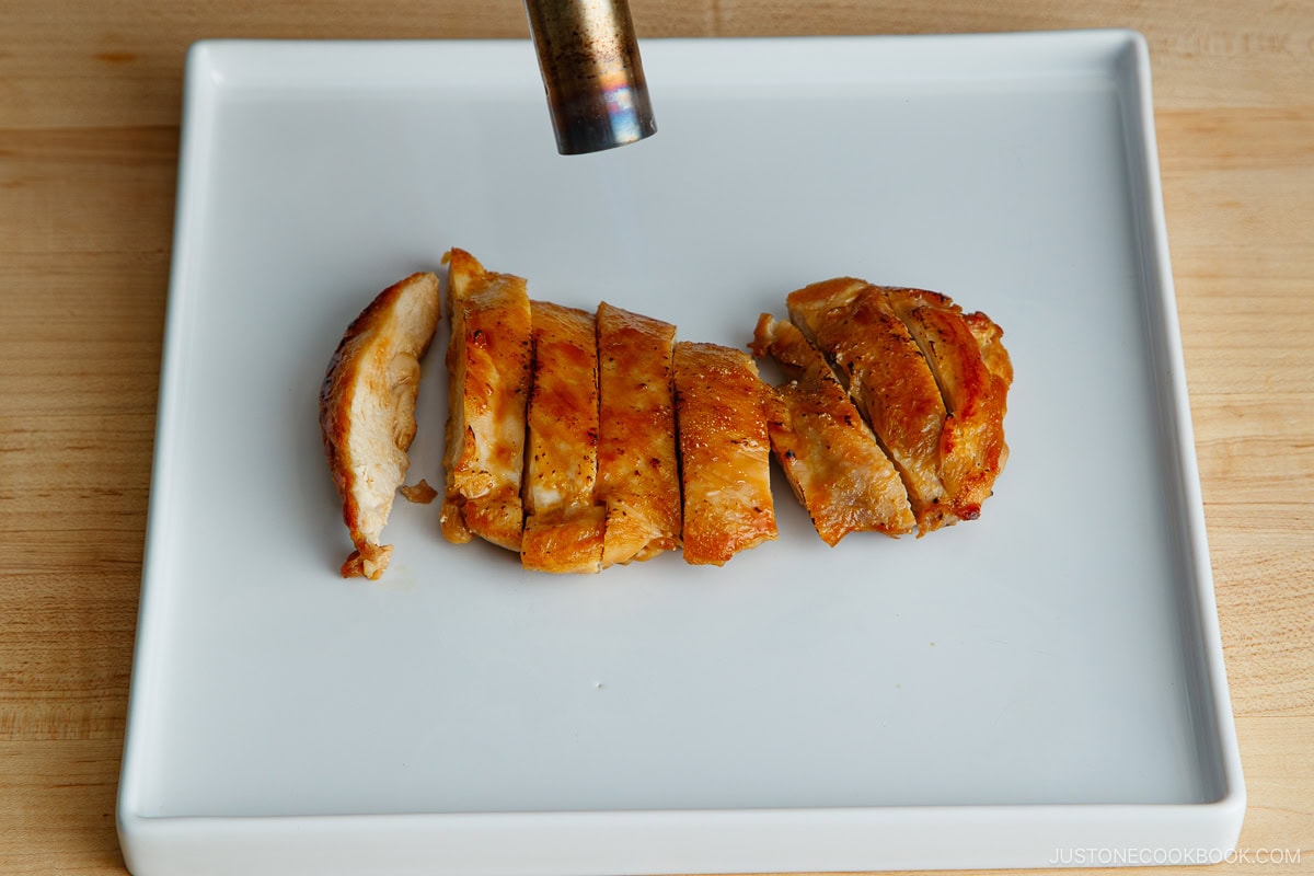 Sear the chicken with butane torch