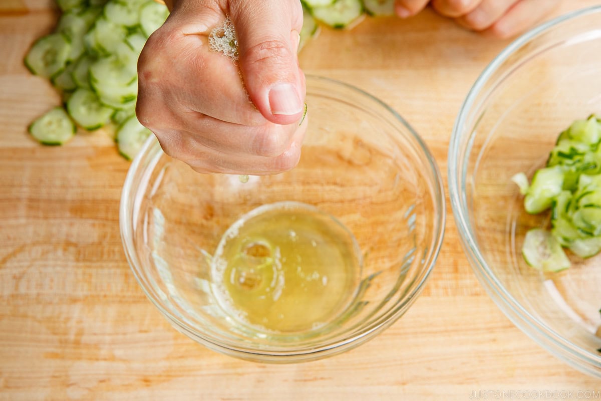 Squeeze cucumber slices to remove moisture.