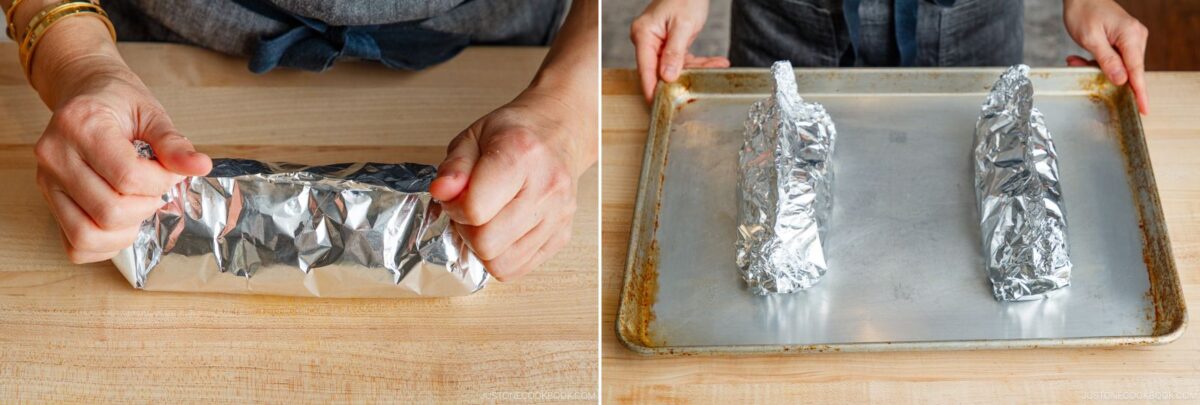 A person wraps miso salmon in foil on a wooden surface; next, two foil-wrapped items are placed on a metal baking sheet, ready for baking.