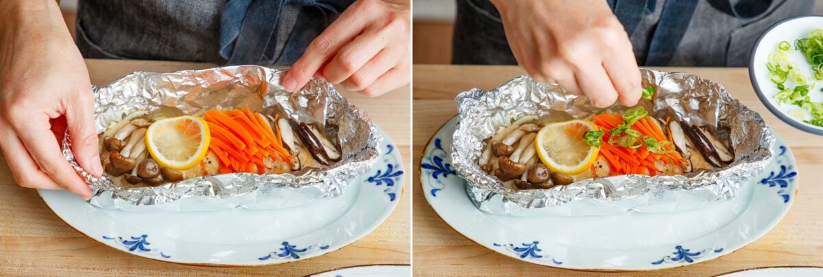 A person wraps grilled vegetables, mushrooms, and lemon slices in aluminum foil alongside miso salmon in foil, then garnishes the dish with chopped green onions on a plate.